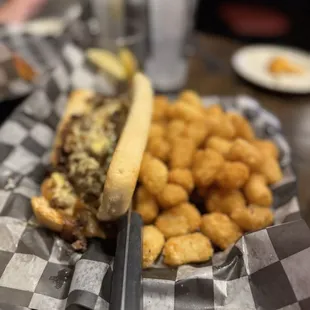 Philly cheesesteak with tots! Big portions!