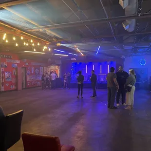 a group of people standing in a room