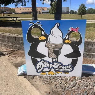 three penguins eating ice cream