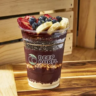 a smoothie with bananas, strawberries, and blueberries