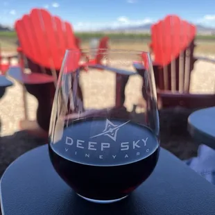 a glass of wine on a table