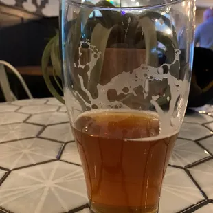 a glass of beer on a table