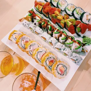 various types of sushi on a platter