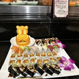 various types of sushi on a plate