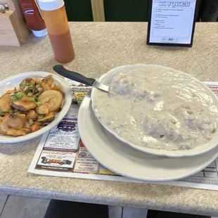 Sausage gravy and biscuits, with a side of deep fried home fries and peppers and onions