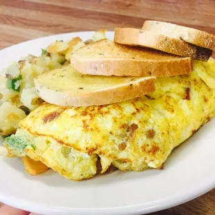 Farmers omelet with bacon, home fries, and rye toast