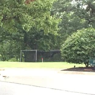 No driving range, but small hitting into a net area for warm up.