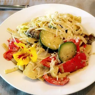 a plate of pasta and vegetables