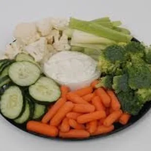 a plate of vegetables and dip