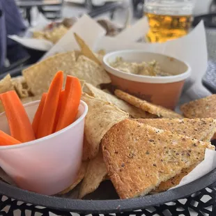 Roasted garlic hummus with toast points and tortilla chips.
