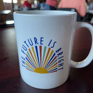 a coffee cup with the words future is bright