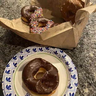 Smashed donuts in paper bag