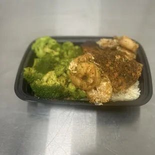 Salmon and shrimp rice bowl with broccoli