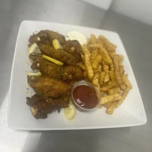 Lemon pepper wings, seasoned fries, and homemade ranch.