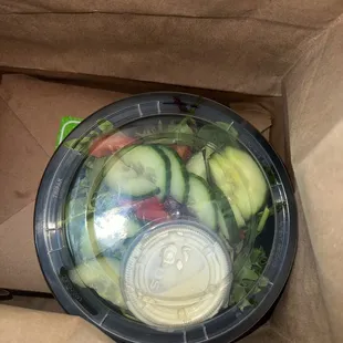 a salad in a paper bag