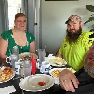 a group of people sitting at a table