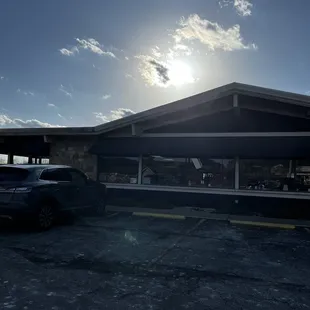 a car parked in front of a restaurant