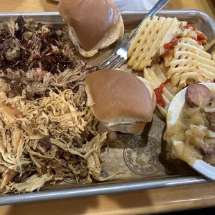 Combo no.2 pull pork and pulled Chicken , waffle fries Nd cabbage and sausage. Yummy