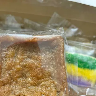 a hand holding a piece of cake