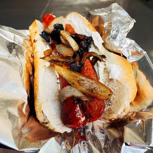 a hot dog with onions and ketchup