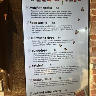 a menu on a brick wall