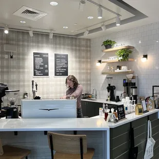 a woman working in a coffee shop