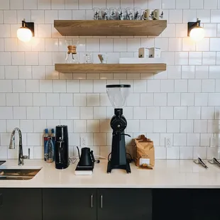 a coffee grinder on a kitchen counter
