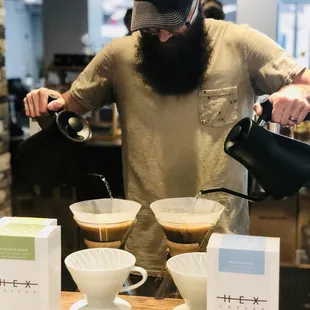 Kiefer preparing for the coffee tasting at the grand opening event