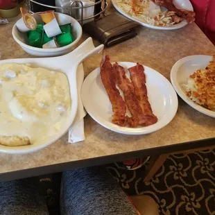 Biscuits and gravy , bacon and hashbrowns.