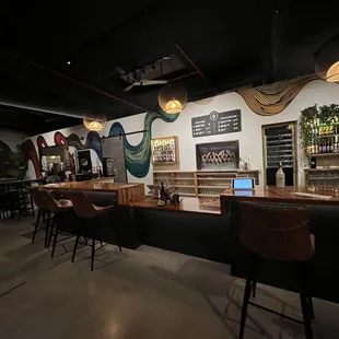 a bar with a laptop on the counter