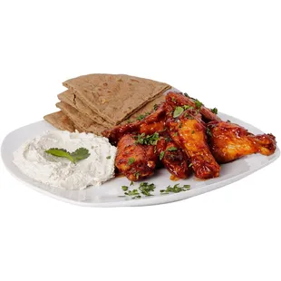 BBQ wings with Hummus and pita bread