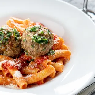 a plate of pasta and meatballs