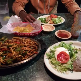Sizzling chicken fajitas and chicken chalupa.