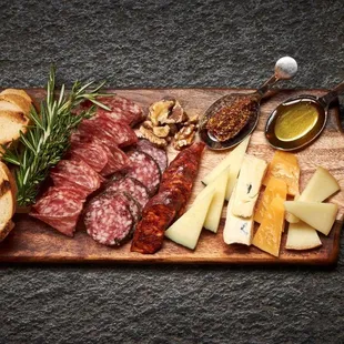 Sample regional cheeses and artisan meats paired with a bold glass of wine.