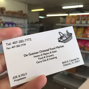 hand holding business card