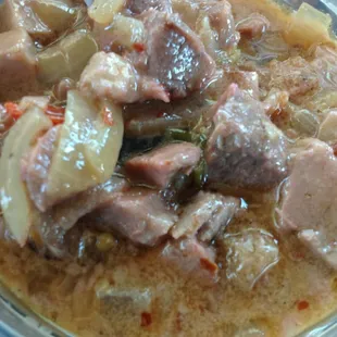 Bicol express - tender pork cooked in coconut milk with shrimp paste and chilies.