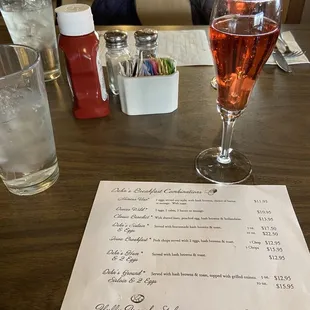 Poinsettia (champagne and cranberry juice) and menu/placement.
