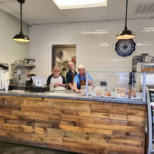 two people behind the counter