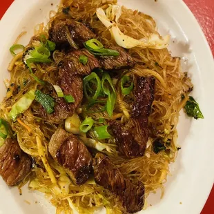 Steak pansit over rice noodles
