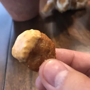 Jalapeño coin. Deep fried goodness dipped in their homemade remoulade sauce!