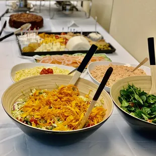 a variety of salads on a table