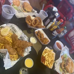 Burgers, fries, onion rings, chicken finger platter, fried pickles