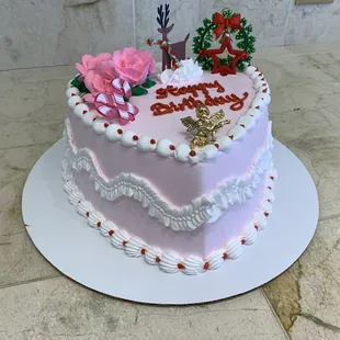 a pink birthday cake