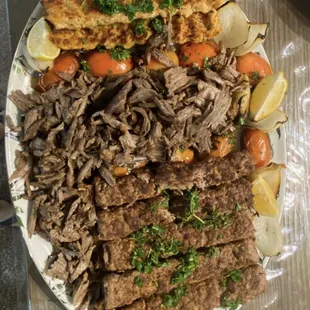 a plate of meat and vegetables