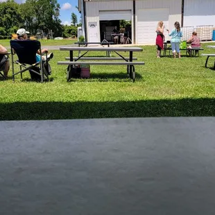 a group of people sitting in lawn chairs