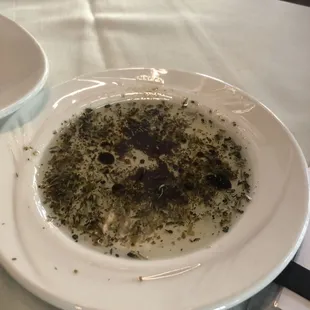 Olive oil with herbs and a balsamic drizzle.
