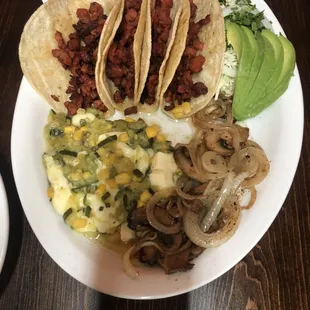 Tacos al pastor with a side of salted mushrooms and calabazita