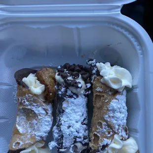 a close up of a pastry in a styrofoam container
