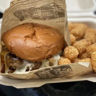 a hamburger and tater tots