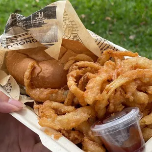 onion rings in a styrofoam container